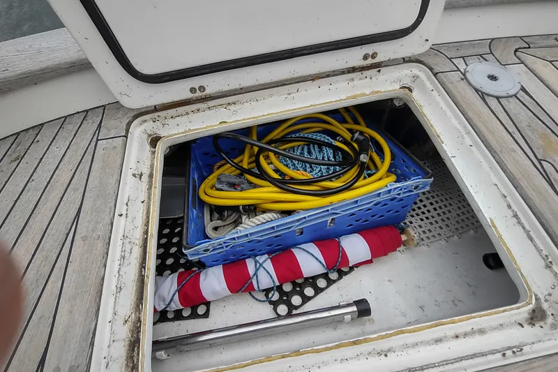 Slide: The Image of Storage compartment on 2005 Hallberg-Rassy 43 yacht with cables and equipment. - 23
