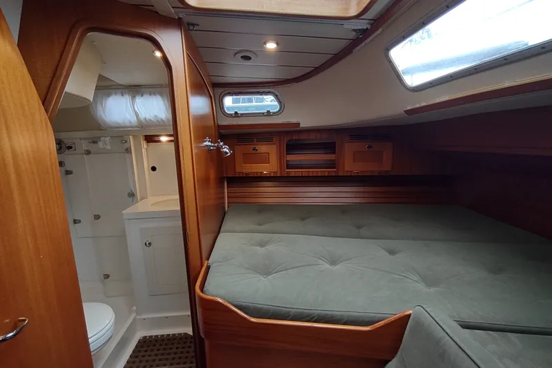 Slide: The Image of Cozy interior of 2005 Hallberg-Rassy 43 yacht with bed and bathroom. - 54