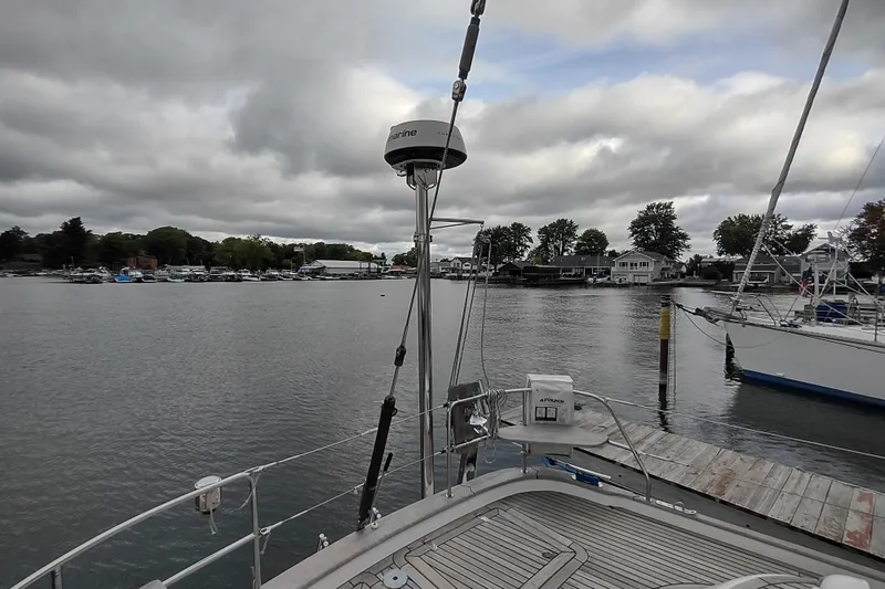 Slide: The Image of Sailboat docked at marina, cloudy sky, Hallberg-Rassy 43, 2005 model. - 22