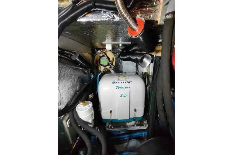 Slide: The Image of Engine compartment of a 2005 Hallberg-Rassy 43 yacht with Mastervolt Whisper 3.5 generator. - 59