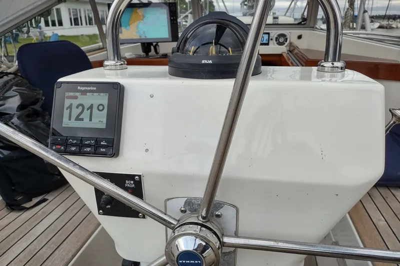 Slide: The Image of Steering console of a 2005 Hallberg-Rassy 43 sailboat with navigation instruments. - 26