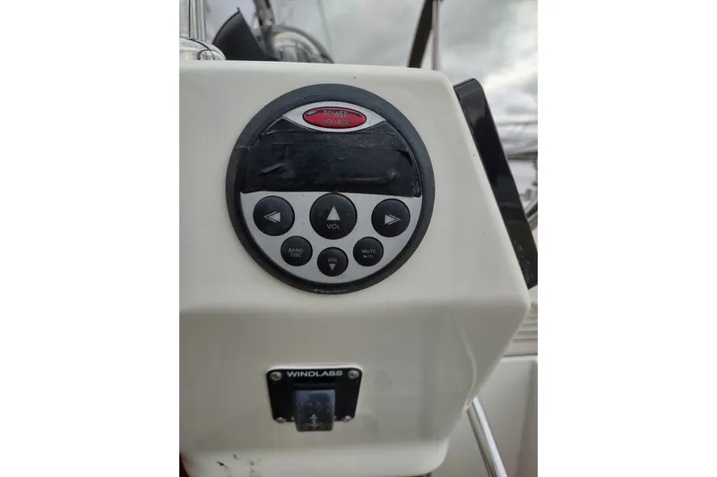 Slide: The Image of Control panel on a 2005 Hallberg-Rassy 43 sailboat, featuring audio and windlass controls. - 28
