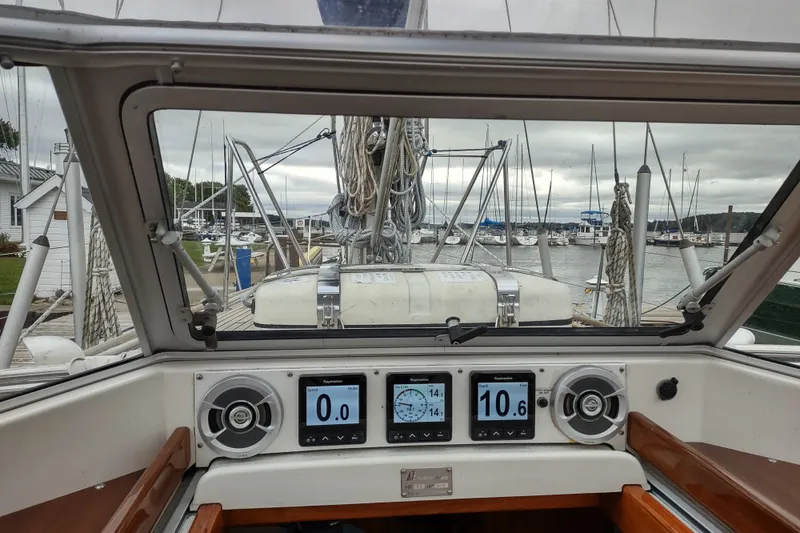 Slide: The Image of Cockpit view of a 2005 Hallberg-Rassy 43 sailboat with navigation instruments. - 31