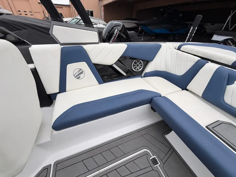 Slide: The Image of Interior of a 2021 Tigé 22RZX with blue and white seating. - 19