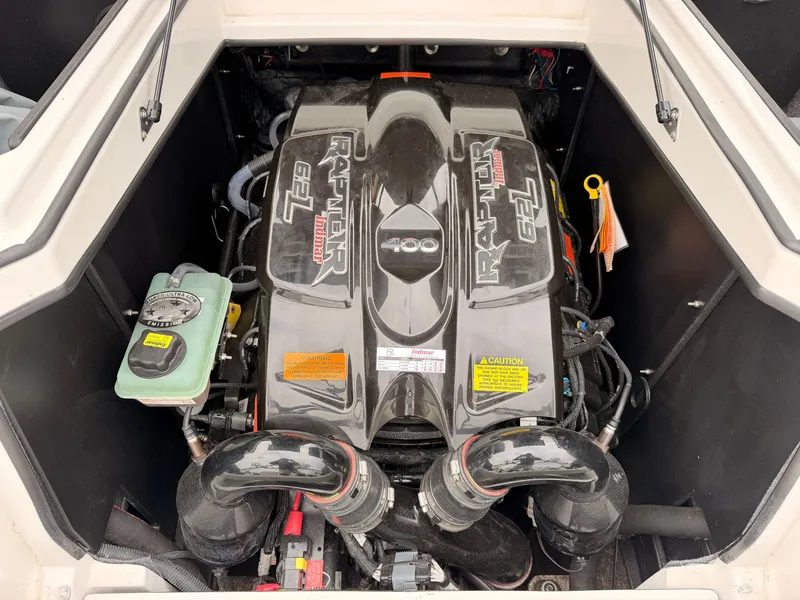 Slide: The Image of The engine compartment of a 2021 Tigé 22RZX with a Raptor 400 engine, clean and well-organized. - 17