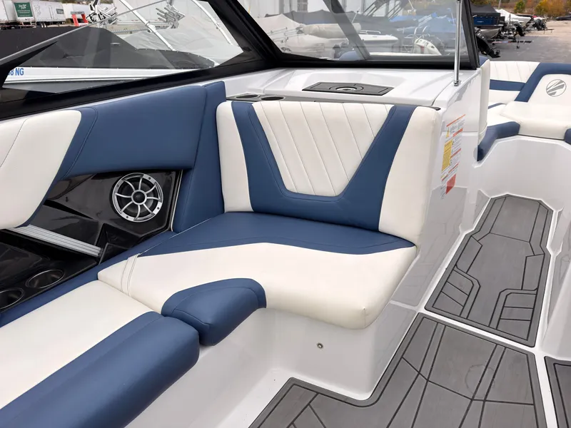 Slide: The Image of The image shows the interior of a 2021 Tigé 22RZX with blue and white seating. - 30