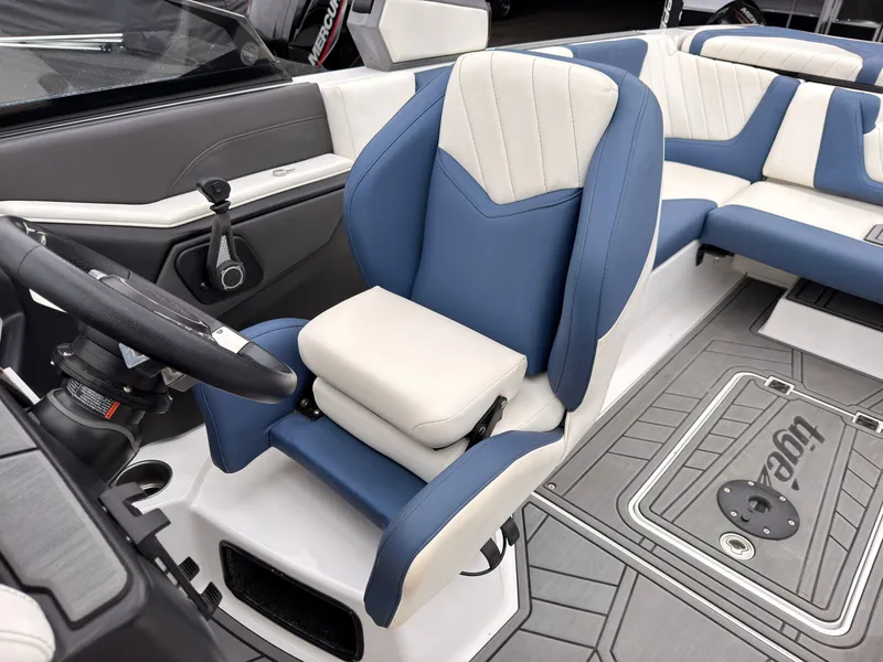 Slide: The Image of The image shows the interior of a 2021 Tigé 22RZX boat with blue and white seating. - 38