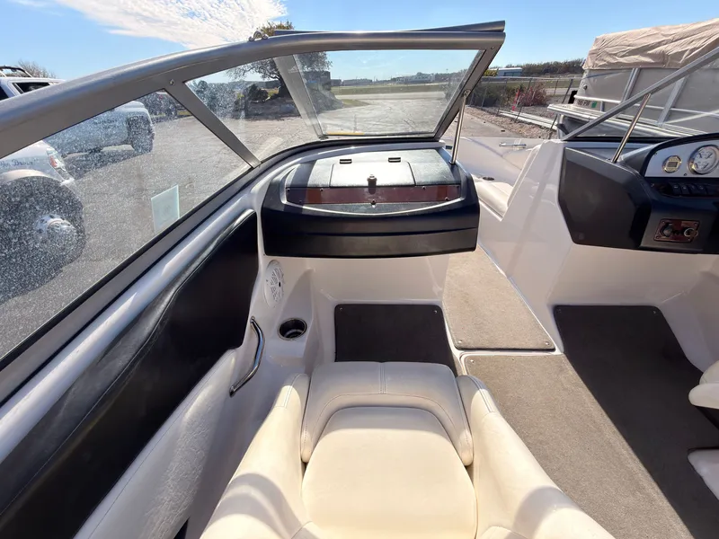 Slide: The Image of Interior view of a 2008 Regal 1900 Bowrider with beige seating and dashboard. - 18