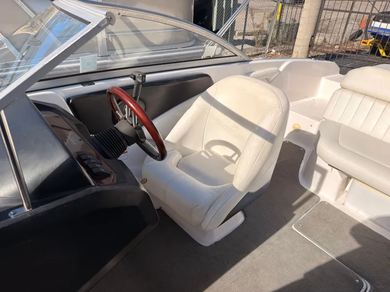 Slide: The Image of The image shows the cockpit of a 2008 Regal 1900 Bowrider with white seats. - 21