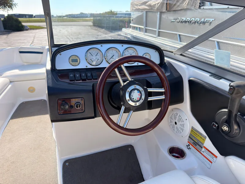 Slide: The Image of The image shows the cockpit of a 2008 Regal 1900 Bowrider with a wooden steering wheel. - 22