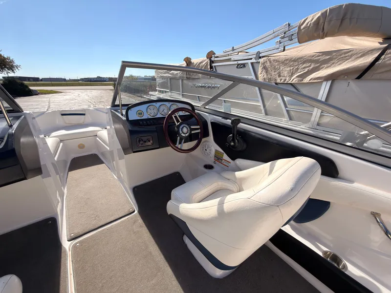 Slide: The Image of The image shows the cockpit of a 2008 Regal 1900 Bowrider with a white seat and dashboard. - 23