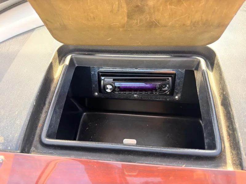 Slide: The Image of A radio is installed in a black compartment on a boat. - 19