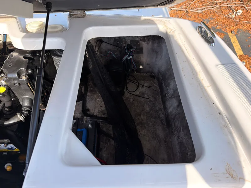 Slide: The Image of An open engine compartment of a 2008 Regal 1900 Bowrider with visible wires and engine. - 15