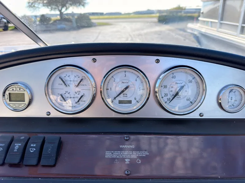 Slide: The Image of Dashboard of a 2008 Regal 1900 Bowrider with various gauges and switches. - 28