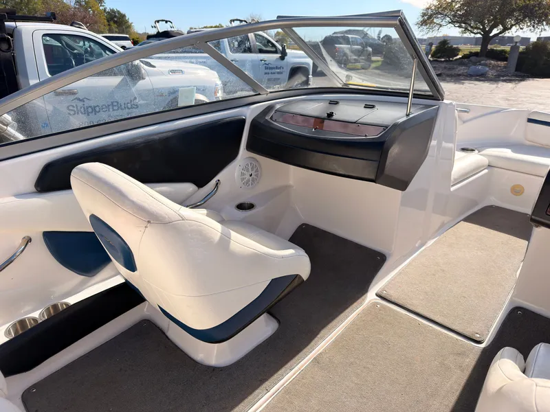 Slide: The Image of Interior view of a 2008 Regal 1900 Bowrider with white and blue seating. - 17