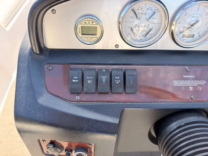 Slide: The Image of The dashboard of a 2008 Regal 1900 Bowrider with switches and gauges. - 26