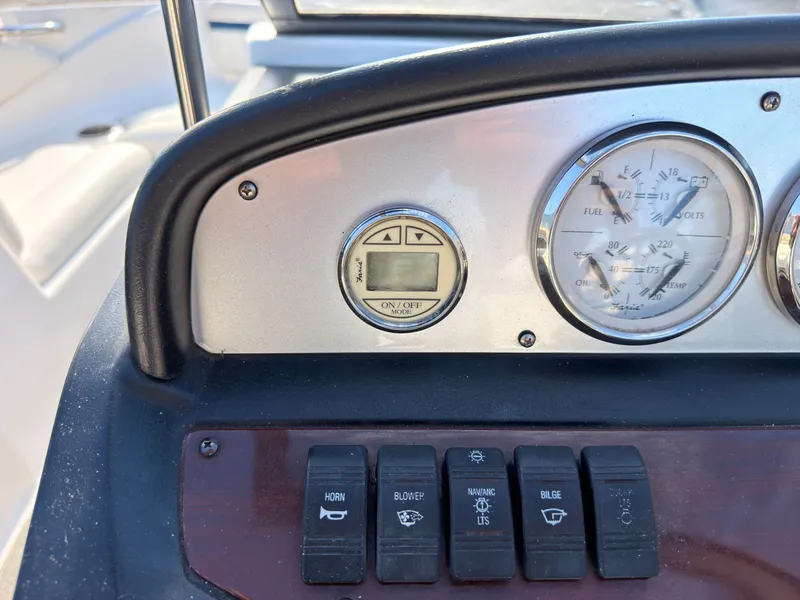 Slide: The Image of Close-up of a 2008 Regal 1900 Bowrider dashboard with switches and gauges. - 27