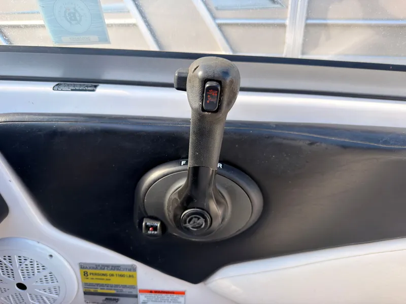 Slide: The Image of Close-up of a boat throttle lever in a 2008 Regal 1900 Bowrider. - 30