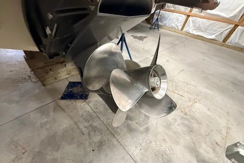 Slide: The Image of 2019 Chris-Craft Launch 27 boat propeller in a garage setting. - 31