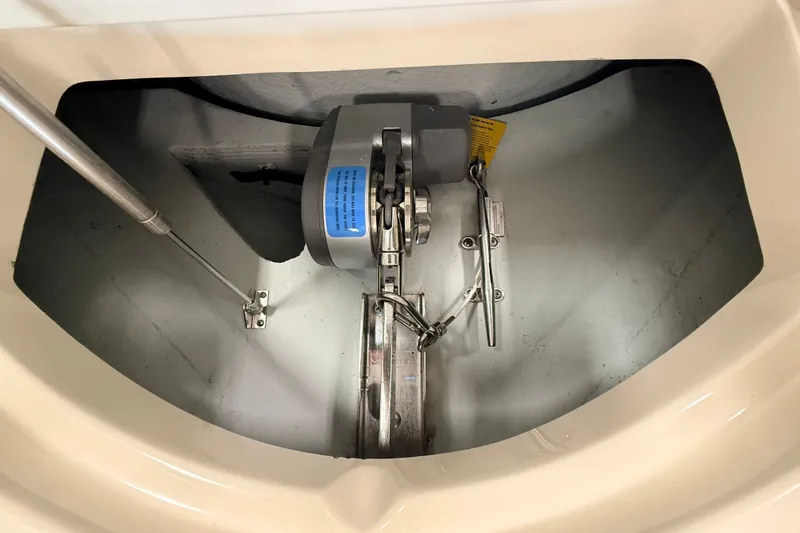 Slide: The Image of Anchor compartment of 2019 Chris-Craft Launch 27 boat, featuring winch and chain mechanism. - 16