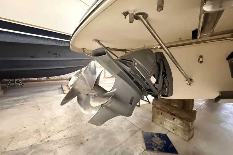 Slide: The Image of 2019 Chris-Craft Launch 27 boat propeller and stern drive in storage. - 30