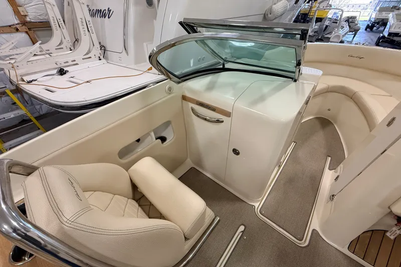 Slide: The Image of 2019 Chris-Craft Launch 27 interior with beige seating and sleek design. - 13