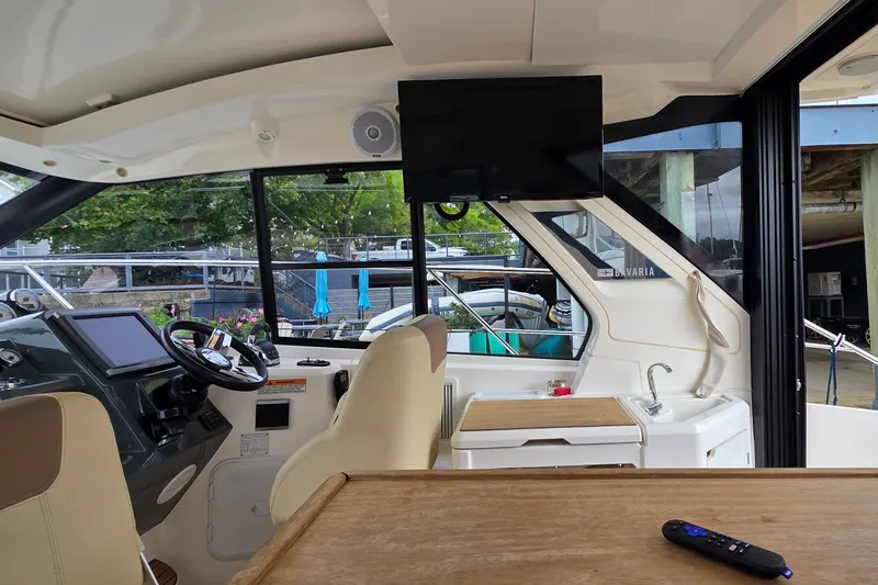 Slide: The Image of Interior of 2015 Bavaria 360 Sport HT yacht with helm, seating, and TV. - 16