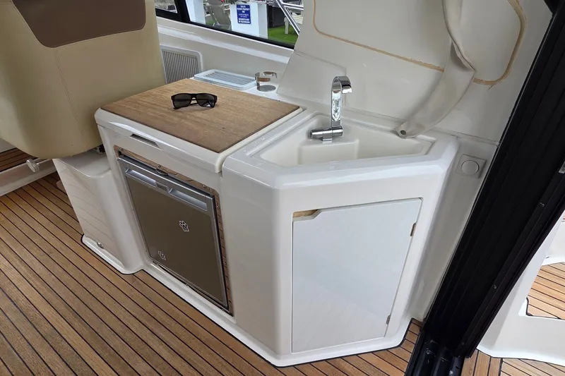 Slide: The Image of Interior of 2015 Bavaria 360 Sport HT yacht with sink and mini fridge. - 13