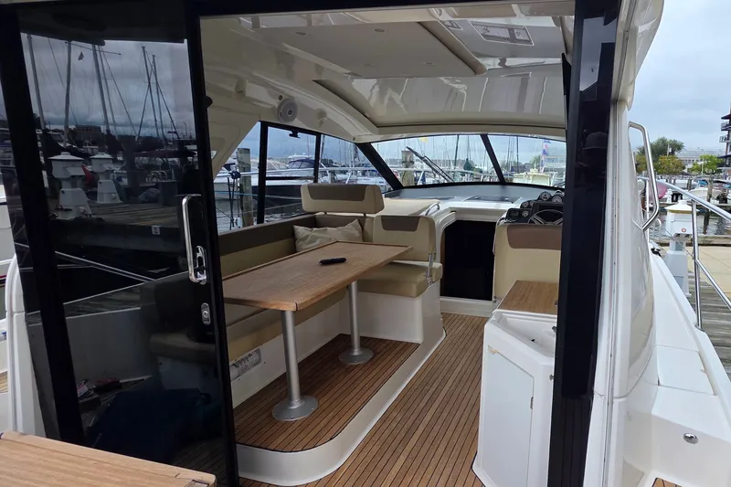 Slide: The Image of Interior view of a 2015 Bavaria 360 Sport HT yacht at a marina. - 12