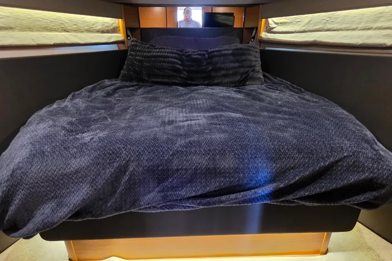 Slide: The Image of Luxurious cabin interior of 2015 Bavaria 360 Sport HT yacht with plush bedding. - 44