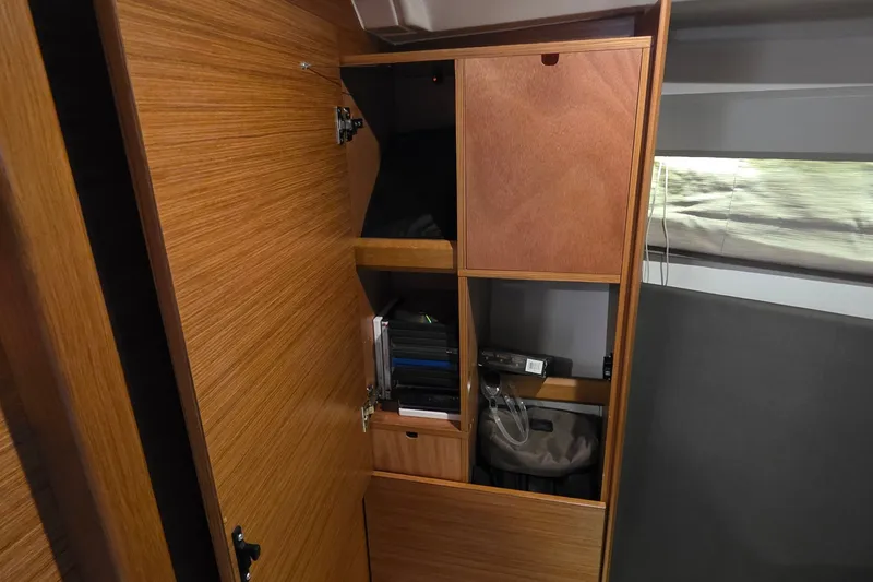 Slide: The Image of Wooden storage cabinet inside 2015 Bavaria 360 Sport HT yacht, featuring shelves and compartments. - 45