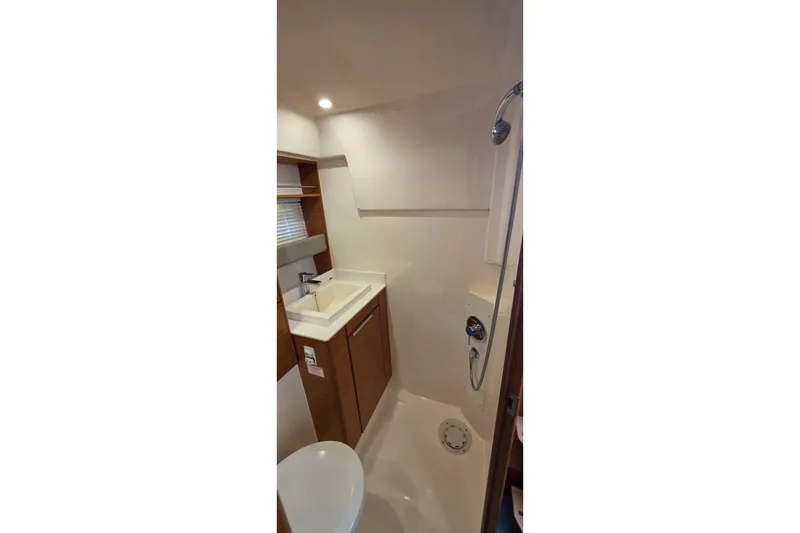 Slide: The Image of Bathroom interior of 2015 Bavaria 360 Sport HT yacht, featuring sink and shower. - 36