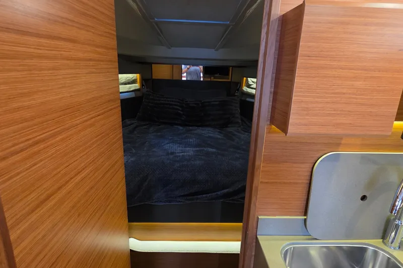 Slide: The Image of Interior cabin of 2015 Bavaria 360 Sport HT yacht with cozy bed and wooden finish. - 43