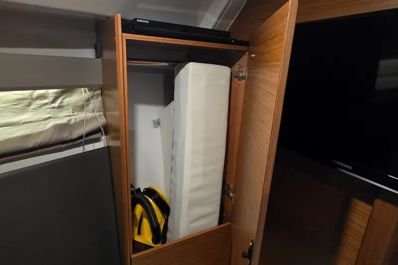 Slide: The Image of Cabinet interior on Bavaria 360 Sport HT 2015 yacht with stored items. - 46