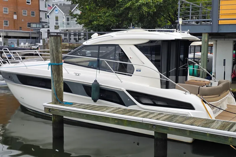 Slide: The Image of 2015 Bavaria 360 Sport HT yacht docked at marina, showcasing sleek design and modern features. - 4