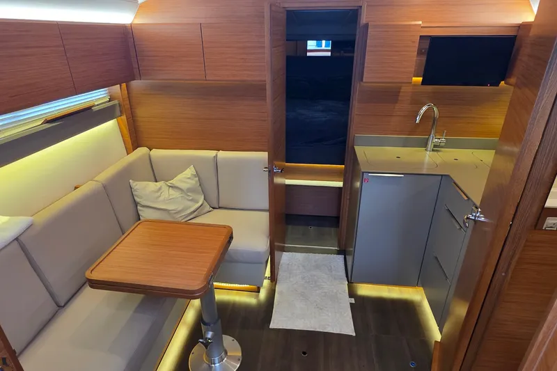 Slide: The Image of Interior of 2015 Bavaria 360 Sport HT yacht with modern kitchen and cozy seating area. - 24