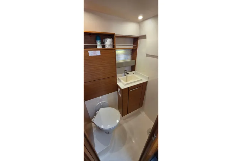 Slide: The Image of Bathroom interior of 2015 Bavaria 360 Sport HT yacht, featuring modern fixtures and wooden cabinetry. - 35