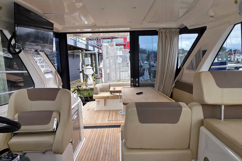 Slide: The Image of Interior of 2015 Bavaria 360 Sport HT yacht with seating, table, and TV. - 22