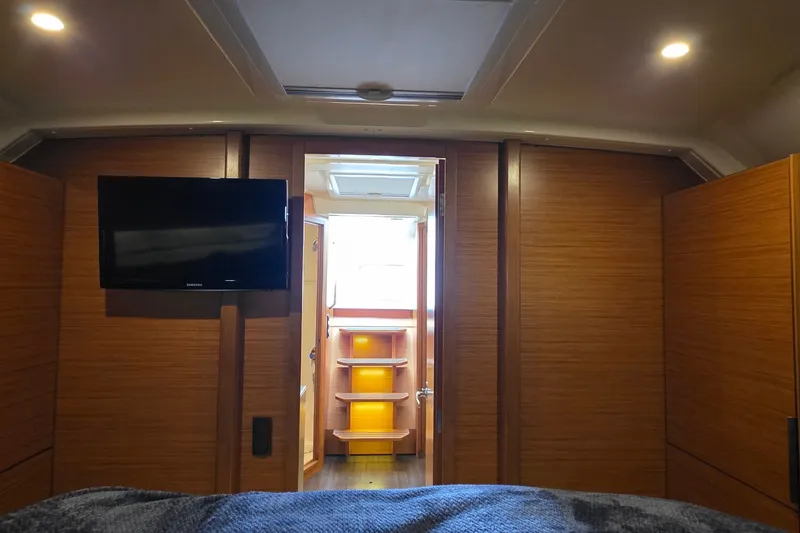 Slide: The Image of Interior of 2015 Bavaria 360 Sport HT yacht with TV and wooden cabinetry. - 47