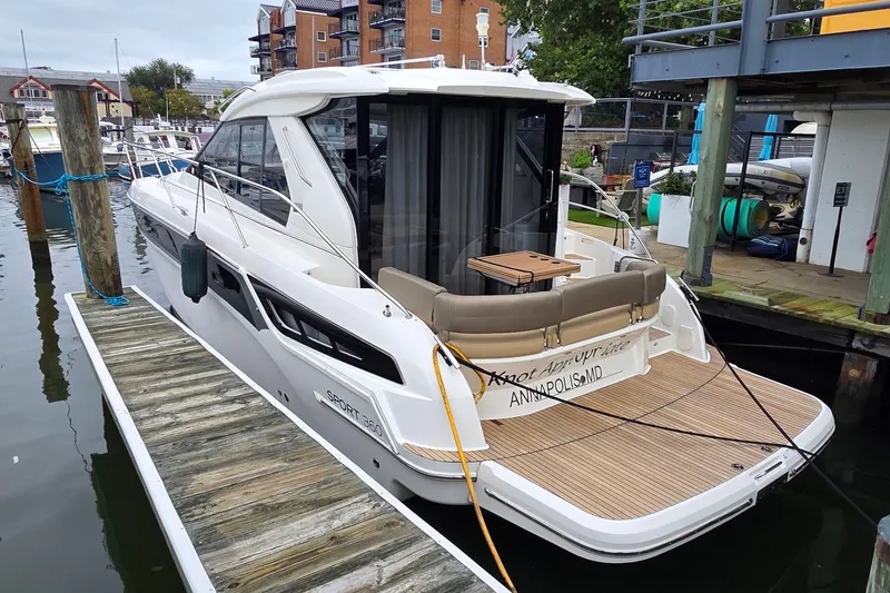 Slide: The Image of 2015 Bavaria 360 Sport HT yacht docked at marina, featuring sleek design and spacious deck. - 3