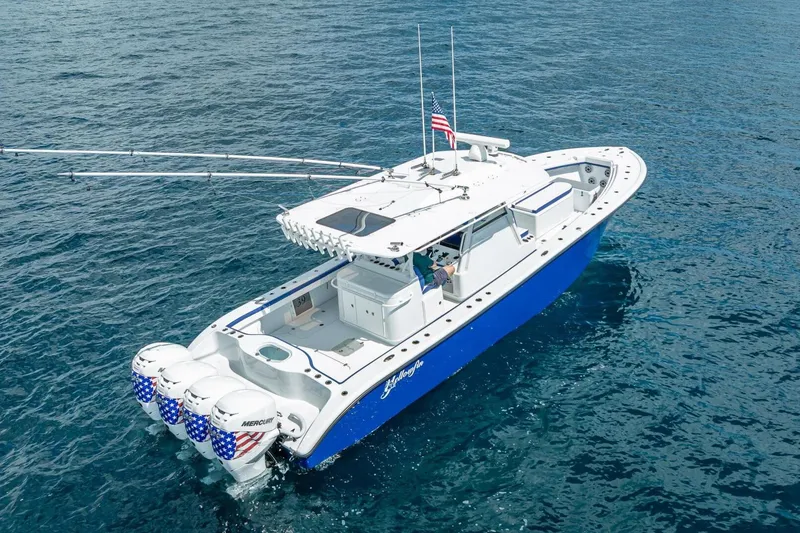 Slide: The Image of 2023 Yellowfin 39 Offshore boat with quad engines on open water. - 19