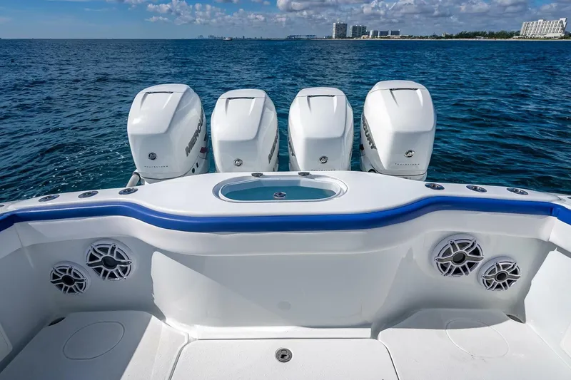 Slide: The Image of 2023 Yellowfin 39 Offshore boat with four powerful outboard engines on open sea. - 68