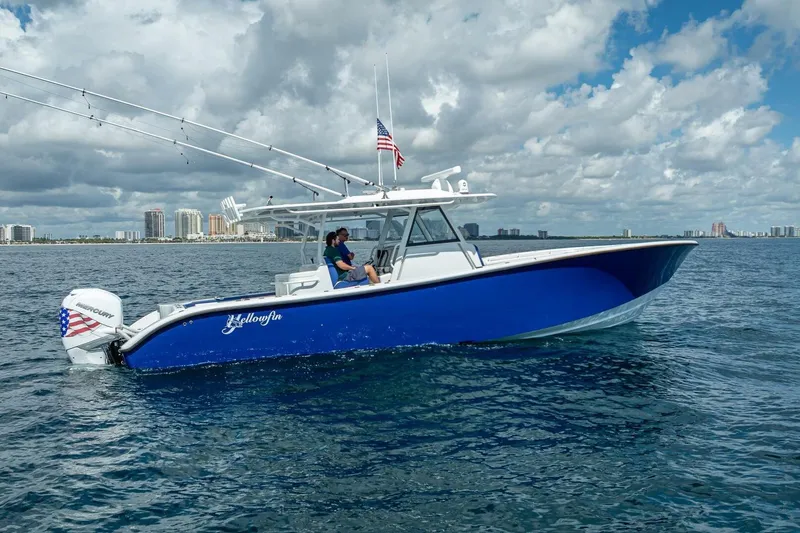Slide: The Image of 2023 Yellowfin 39 Offshore boat cruising on open water under cloudy sky. - 6