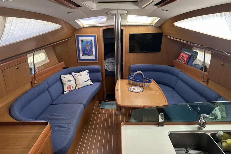 Slide: The Image of Interior of 2007 Jeanneau Sun Odyssey 39 DS yacht with blue seating and wooden finishes. - 17