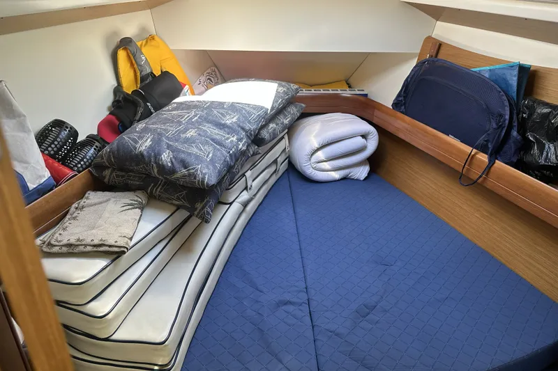 Slide: The Image of Cozy cabin interior of 2007 Jeanneau Sun Odyssey 39 DS sailboat with cushions and storage. - 24