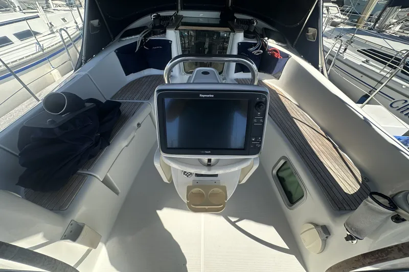 Slide: The Image of Cockpit of 2007 Jeanneau Sun Odyssey 39 DS with navigation equipment. - 13