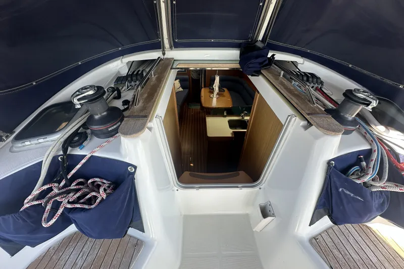 Slide: The Image of Interior view of 2007 Jeanneau Sun Odyssey 39 DS sailboat, showcasing cockpit and cabin entrance. - 14