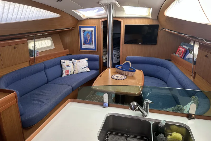Slide: The Image of Interior of 2007 Jeanneau Sun Odyssey 39 DS yacht with blue seating and modern amenities. - 20