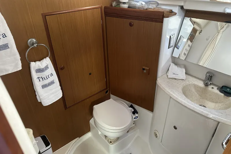 Slide: The Image of Bathroom interior of 2007 Jeanneau Sun Odyssey 39 DS yacht, featuring sink and toilet. - 22