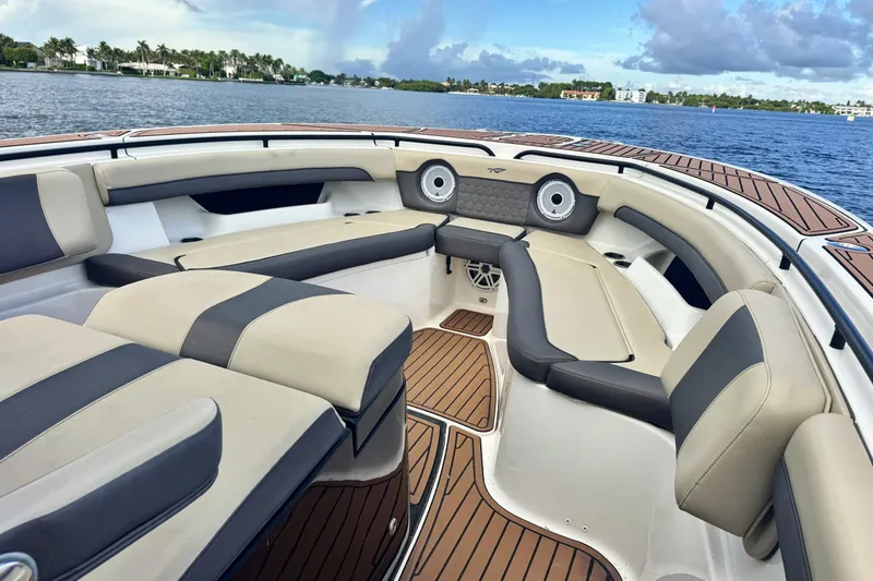Slide: The Image of 2019 Tidewater 320 CC Adventure boat interior with luxurious seating and scenic water view. - 15